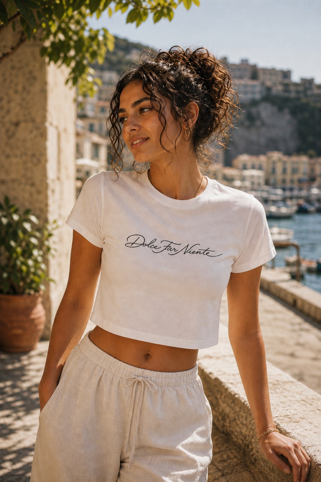 Editorial model wearing the SIAMO Dolce Baby Crop by the water